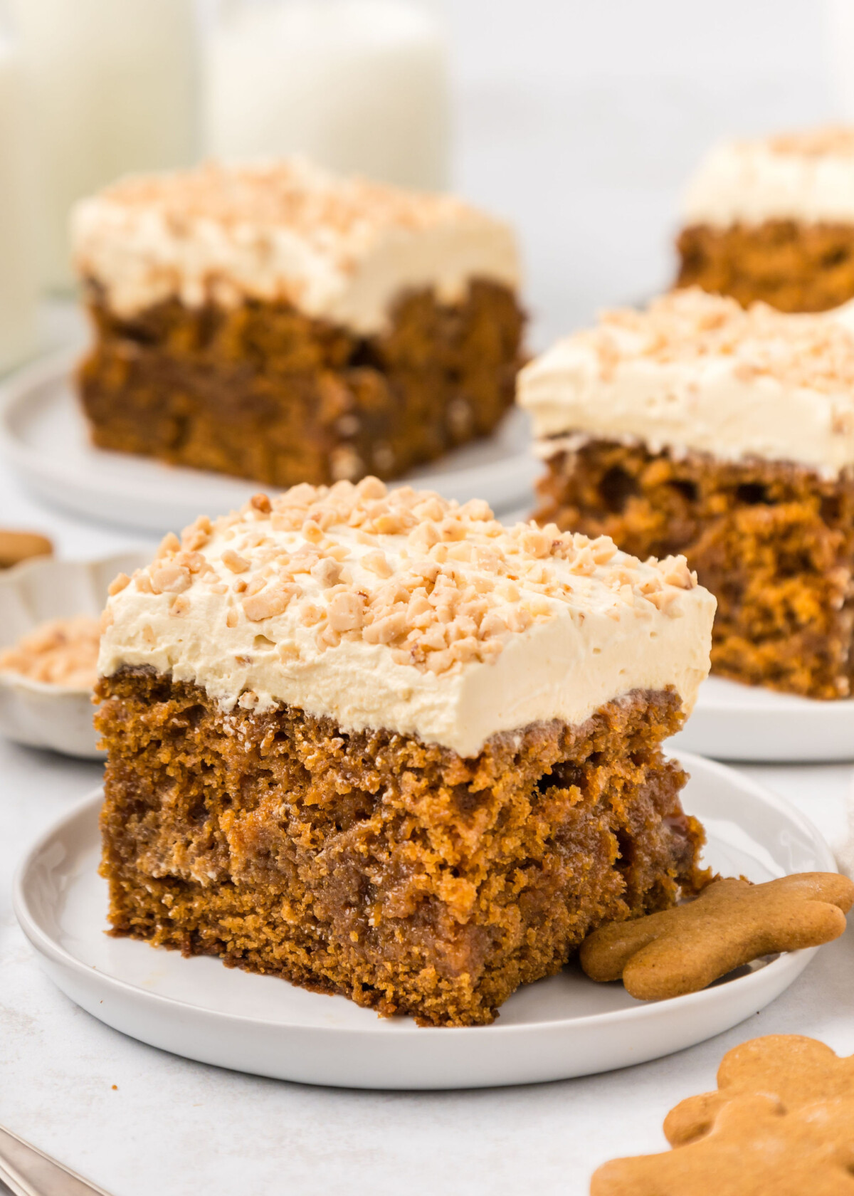 A slice of gingerbread poke cake on a plate.