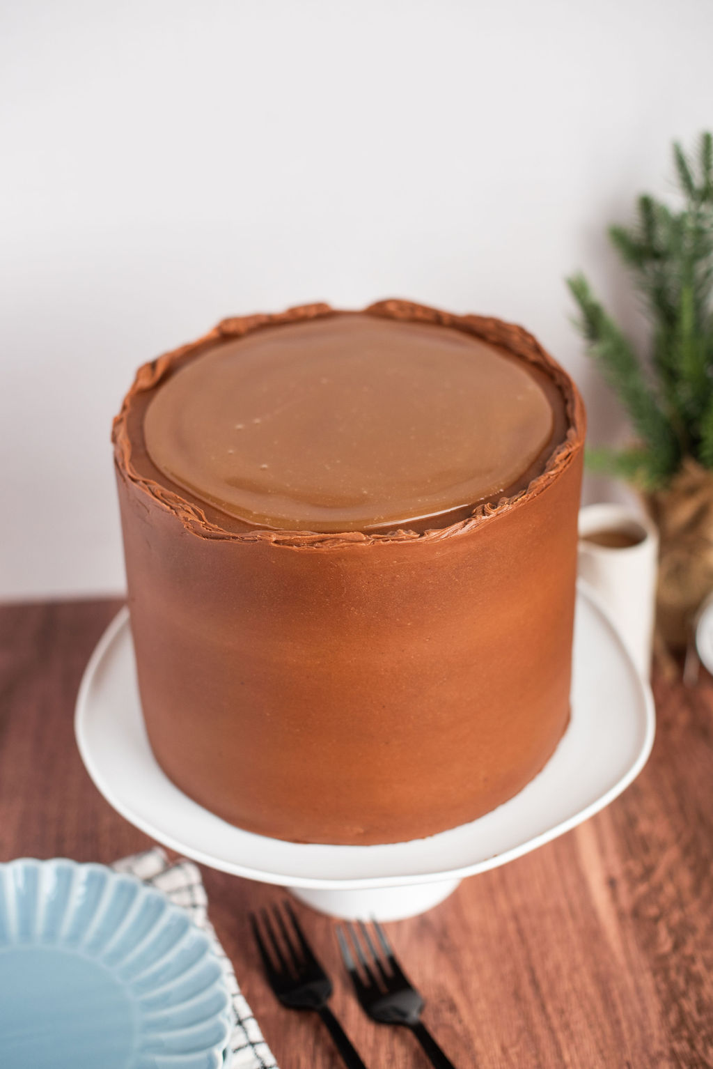 A chocolate cake with caramel on the top of it.