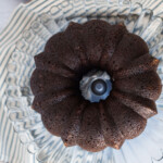 A chocolate banana bundt cake on a cake stand.