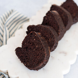 Slices of chocolate banana bundt cake on a tray.