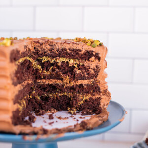 Dubai Chocolate Bar inspired cake on a cake cake stand.