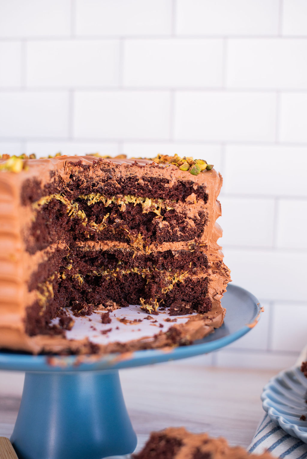 Dubai Chocolate Bar inspired cake on a cake cake stand.