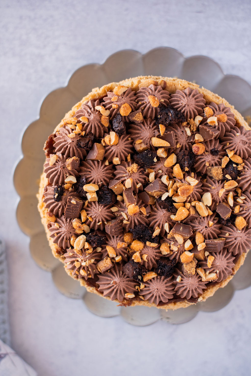 Peanut Butter Brookie Pie on a cake plate.