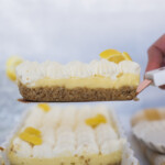A slice of lemon tart on a spatula.
